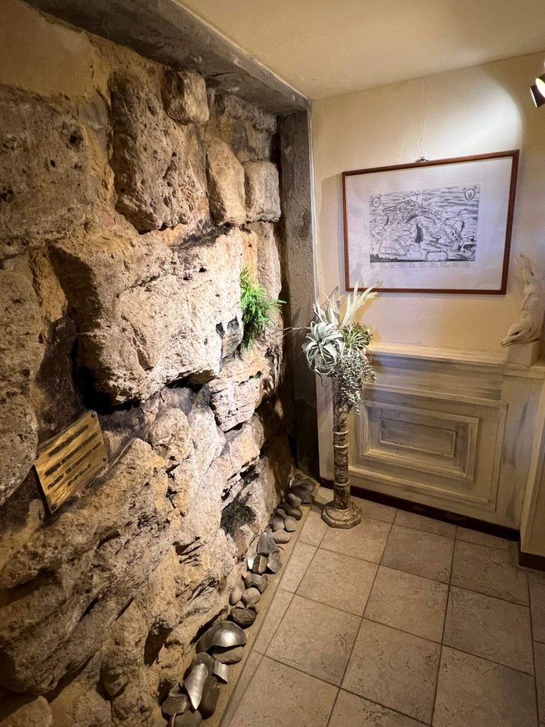 original etruscan wall in etruria hotel in volterra, italy