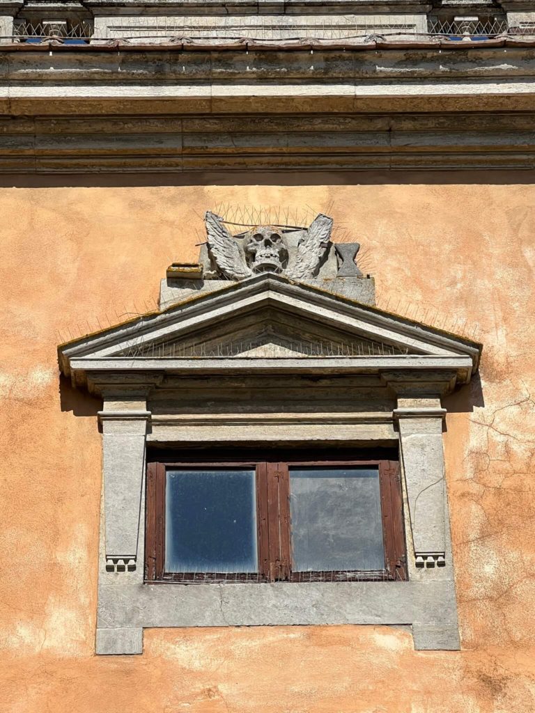 a window with a winged skull on it