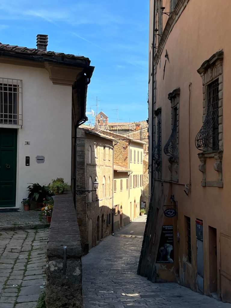 a winding road in volterra, italy