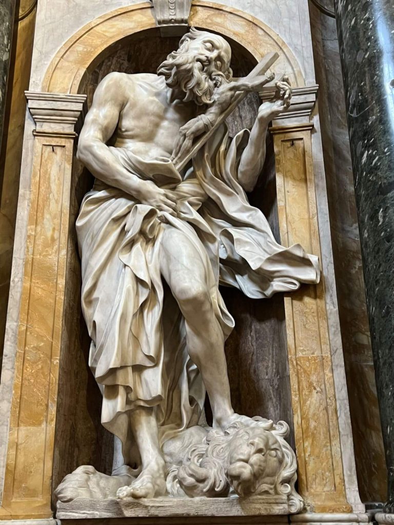sculpture of st jerome playing the cross like a violin