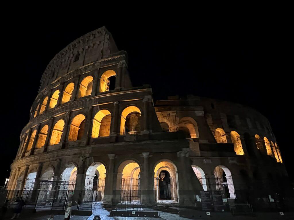 The Roman Colosseum Lit Up At Night