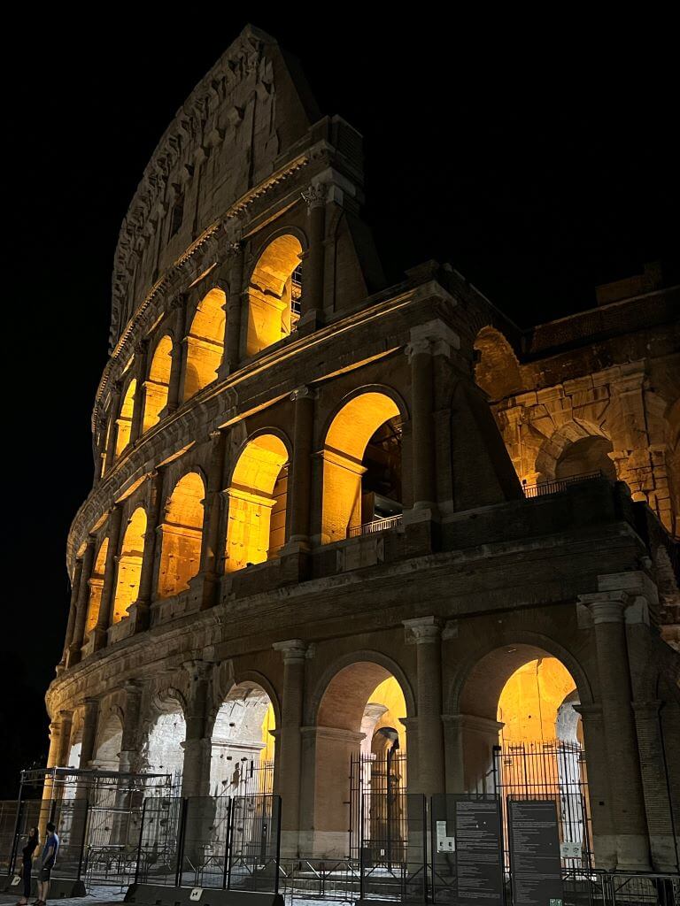 The Roman Colosseum Glowing At Night