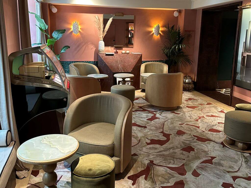 Marble Top Tables And Lounge Chairs Around The Reading Room Of Hotel Florida Paris