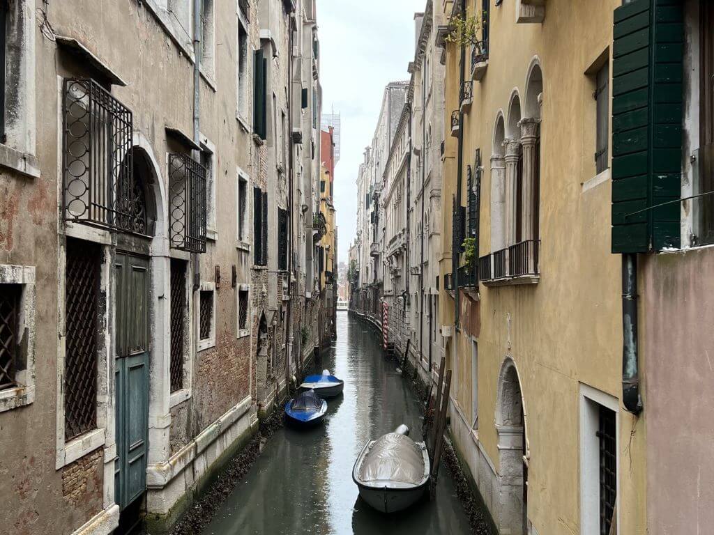 A Narrow Canal In Venice Italy